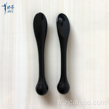 Spatule en plastique noir pour la crème de masque cosmétique